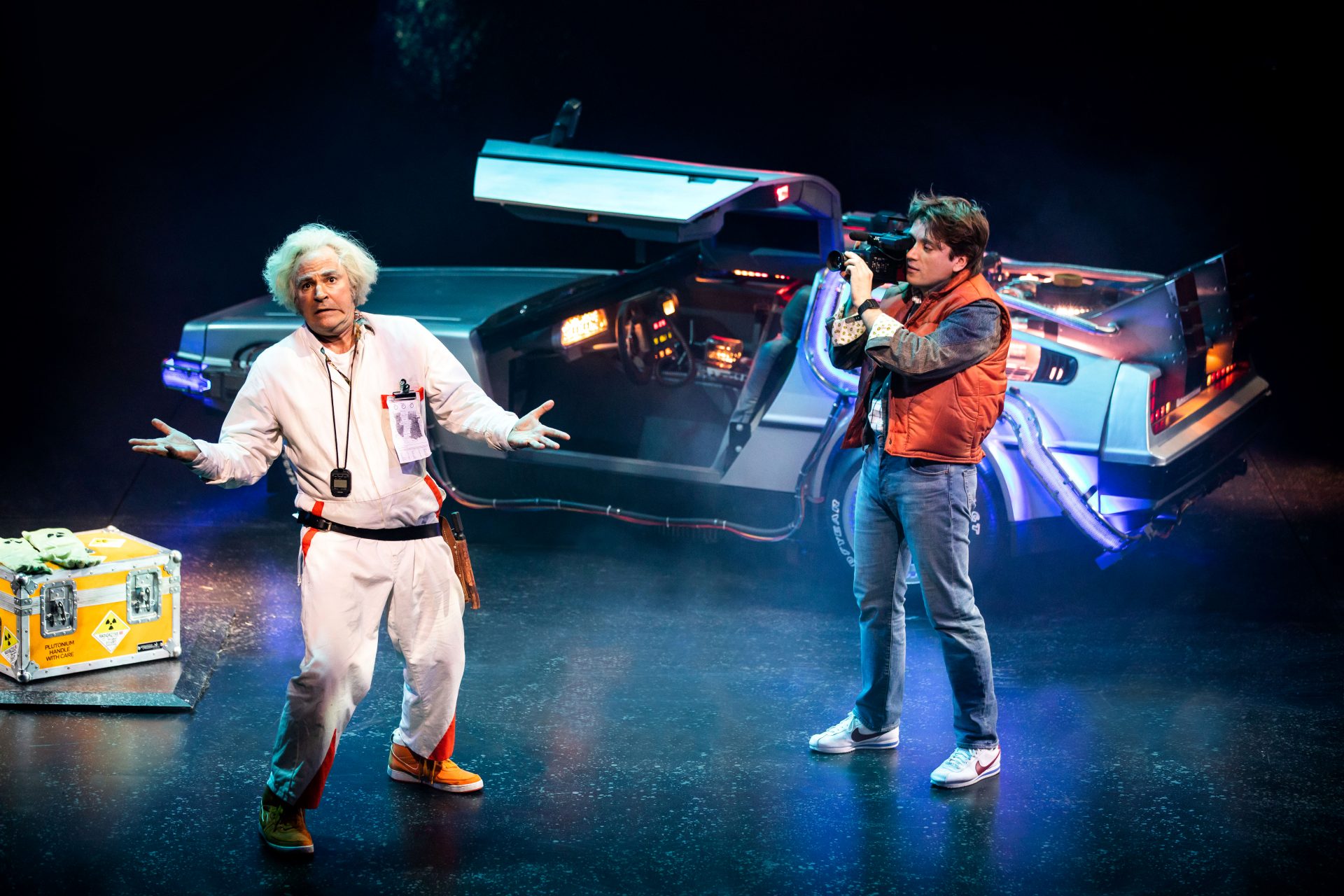 https://www.theneweuropean.co.uk/wp-content/uploads/sites/2/2021/09/Roger-Bart-as-Doc-Brown-Olly-Dobson-as-Marty-McFly-in-Back-to-the-Future-the-Musical-credit-Sean-Ebsworth-Barnes.jpg