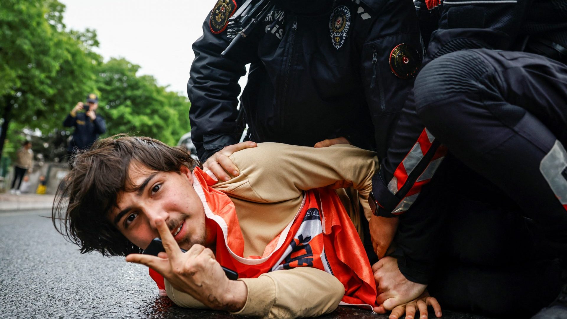 Turkish police detain a protester as he and others attempt to march to Taksim Square on May Day. Photo: Kemal Aslan/AFP/Getty