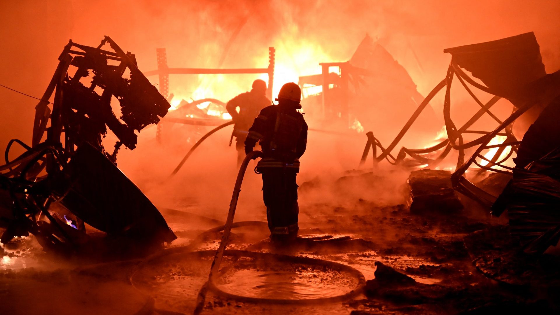 Ukrainian firefighters work to extinguish a fire at the site of a drone attack on industrial facilities in Kharkiv on May 4, 2024. Photo: Sergey Bobok/AFP/Getty