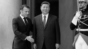 Emmanuel Macron offers his hand to Xi Jinping as he welcomes him to the Élysée Palace. Photo: Kiran Ridley/Getty
