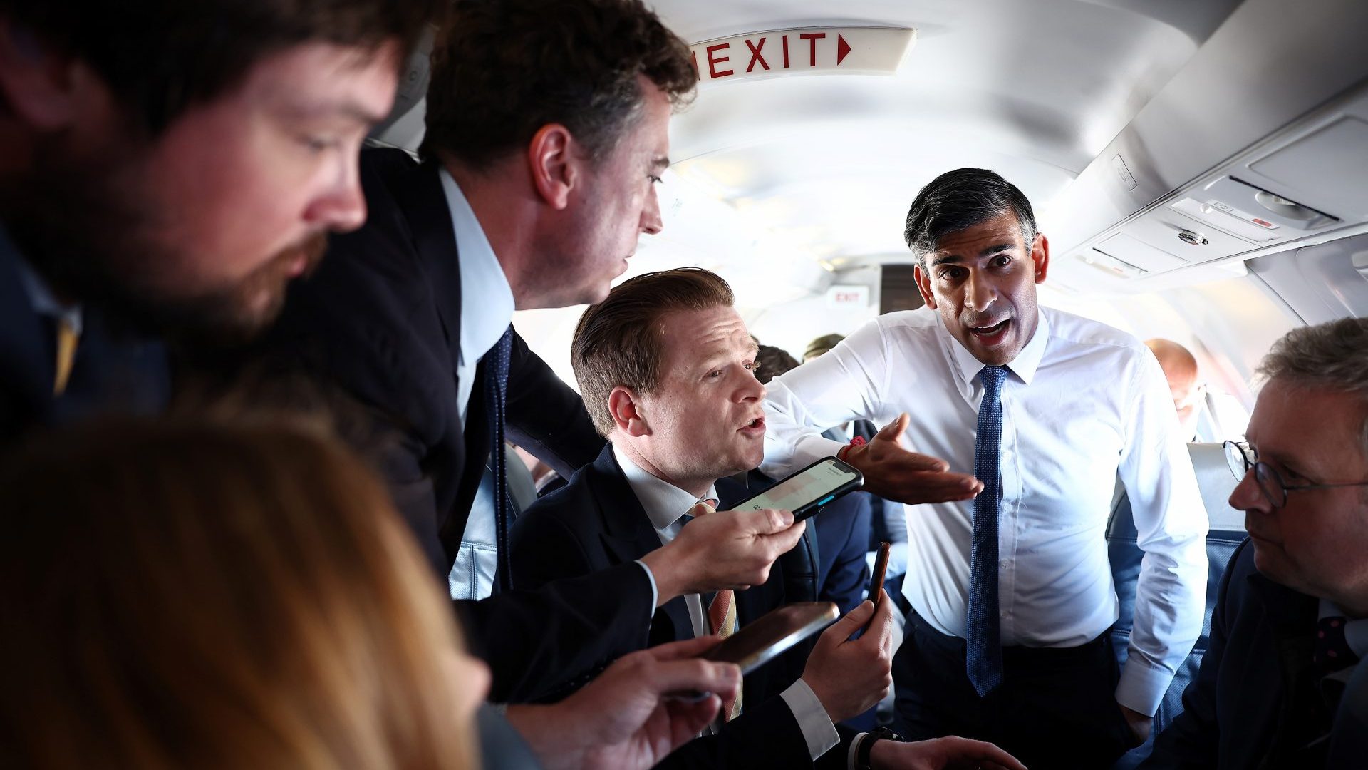 Rishi Sunak speaks to journalists on the plane on their way to Staffordshire (Photo by Henry Nicholls - WPA Pool/Getty Images)