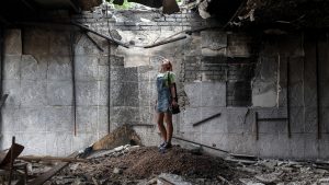 Olia Yakovenko stands in the hall where she used to dance in Borova, Kharkiv, which was hit by Russian bombs. Photo: Viktor Fridshon/Global Images Ukraine/Getty