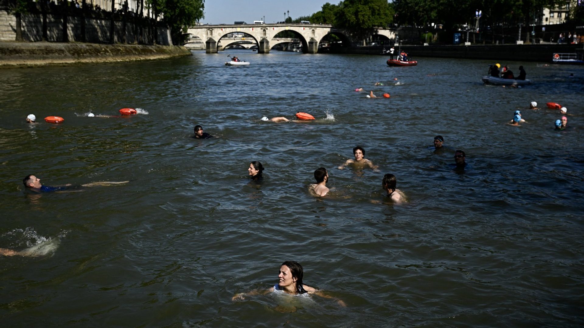Local residents swim in the River Seine in Paris on July 17, 2024 to demonstrate that it is clean enough to host the outdoor swimming events at the Olympics. Photo: Julien de Rosa/AFP/Getty