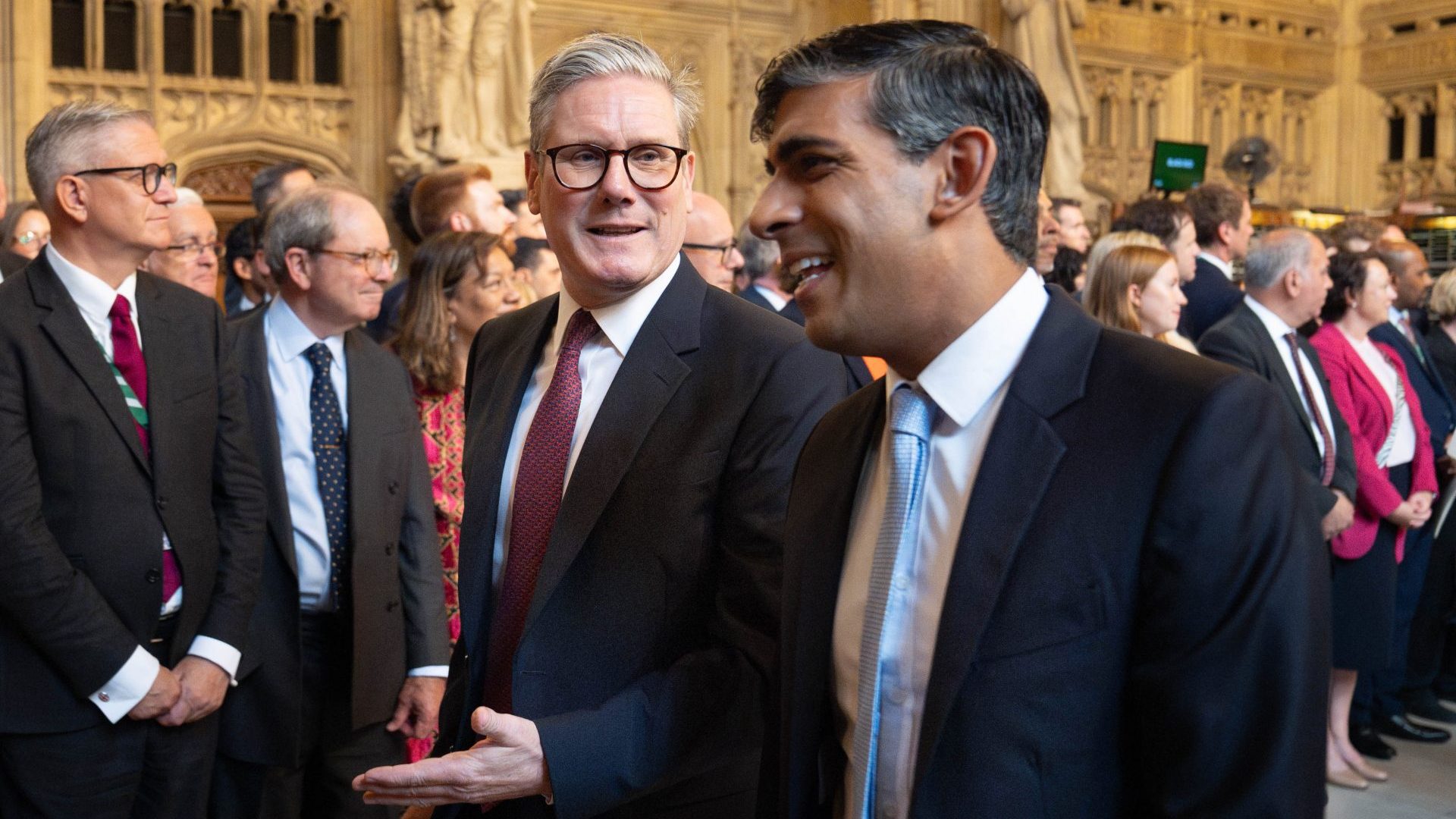 Keir Starmer and Rishi Sunak talk as they walk through the Member's Lobby of the Houses of Parliament to the House of Lords to hear the King's Speech (Photo by Stefan Rousseau - WPA Pool/Getty Images)