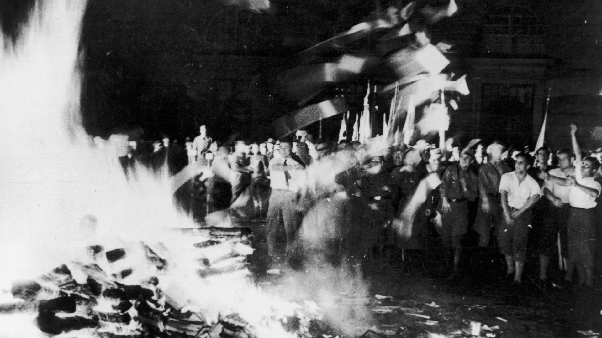 Nazis and students burn “anti-German literature” in the Opernplatz, Berlin on May 10, 1933 – including books by Erich Kästner, who attended the bonfire in secret. Photo: Keystone