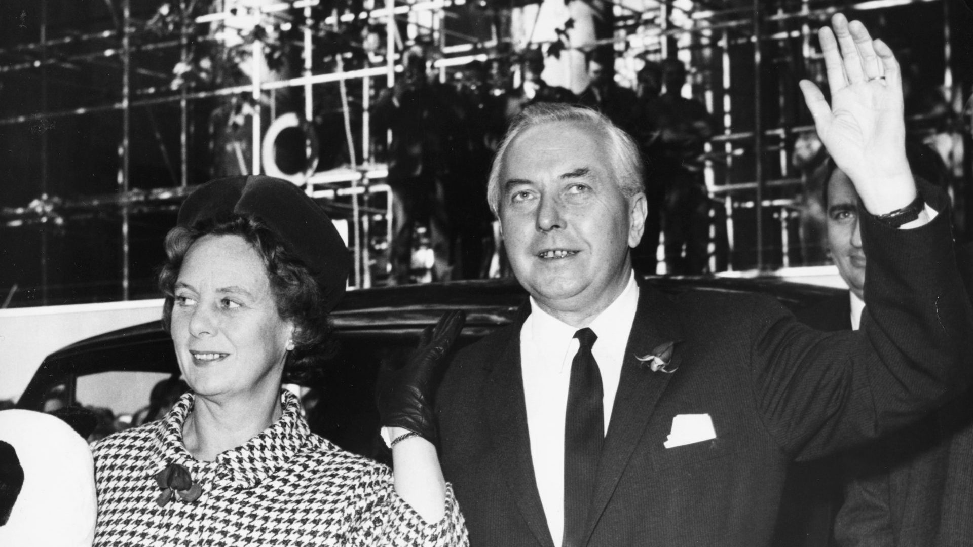 Newly appointed prime minister Harold Wilson with his wife, Mary, waving to the press as he arrives at Labour Party headquarters, Transport House, London, October 16th 1964. (Photo by Reg Speller/Fox Photos/Getty Images)