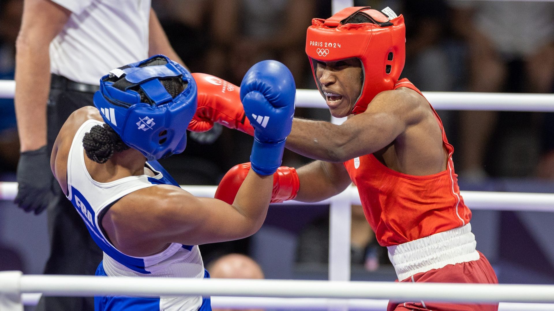 Michel Davina of France (blue) and Cindy Cindy Djankeu Ngamba of Refugee Olympic Team during the Paris 2024 Olympic Games. Photo: Andrzej Iwanczuk/NurPhoto via Getty Images