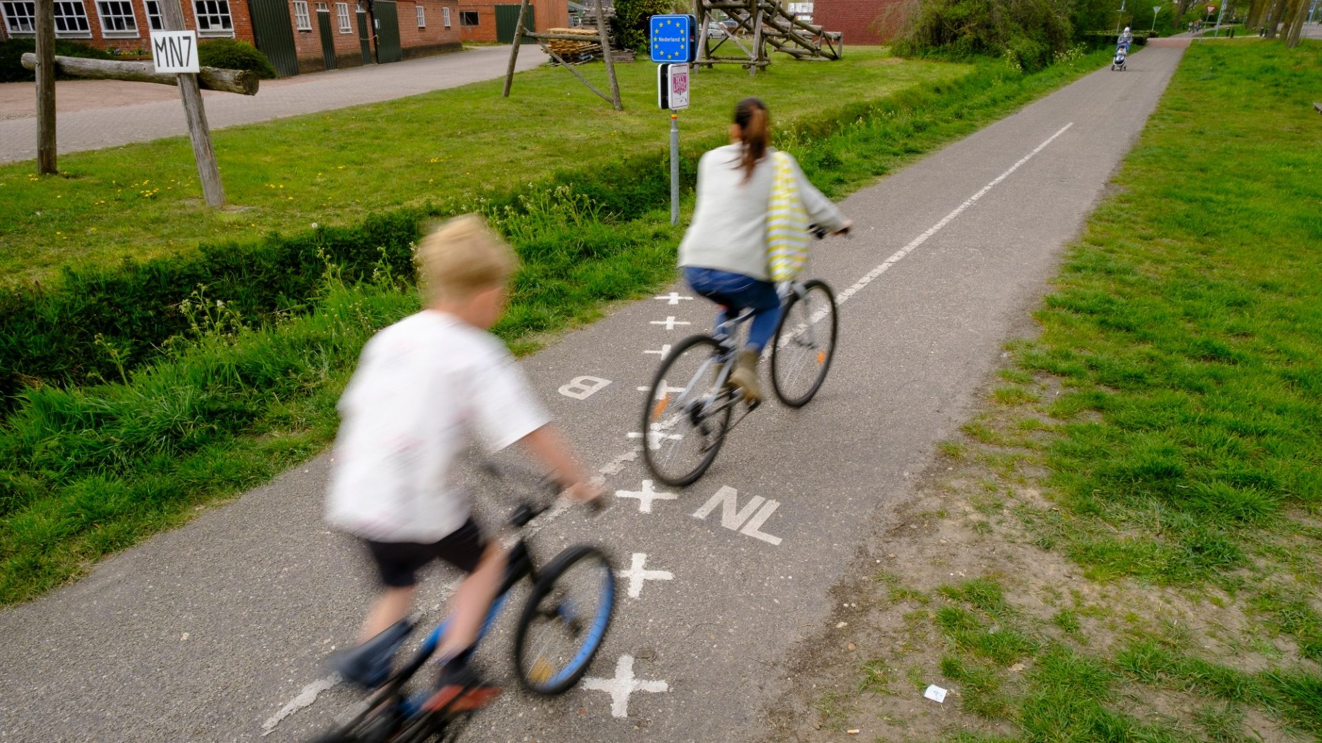 Cyclists cross the border from Belgium to the Netherlands in Baarle-Hertog. Photo: Thierry Monasse/Getty