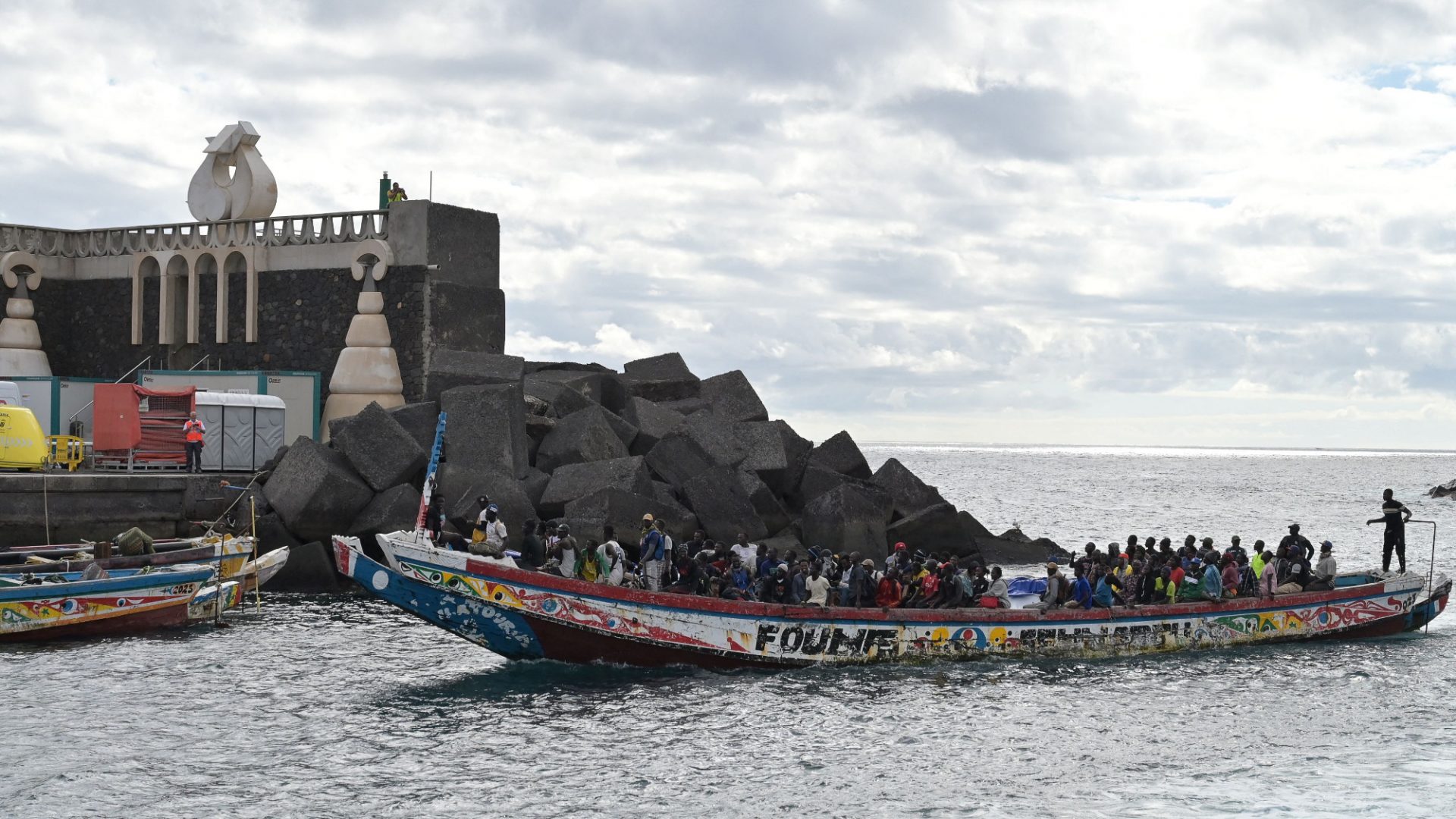 Migrants arrive on a boat at La Restinga dock on the island of El Hierro, the most westerly of Spain’s Canary Islands. Photo: Stringer/AFP/Getty