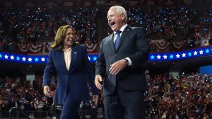 Kamala Harris and Tim Walz on stage together during a campaign event at the Liacouras Center at Temple University in Philadelphia. Photo: Andrew Harnik/Getty