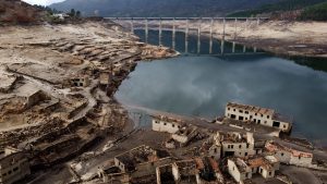 An aerial view of the usually submerged ruins of the former village of Aceredo in Galicia, Spain, appearing from the Lindoso hydroelectric plant reservoir due to the low water level, February 2022. Photo: Carmelo Alen/AFP/Getty