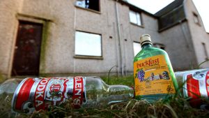 Empty alcohol bottles lay outside disused houses in the village of Lochore, Kirkcaldy. Price increases have been introduced in a bid to tackle the ongoing drink problem in Scotland. Photo: Jeff J Mitchell/Getty