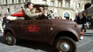 President of ‘Lovers of Chocolate’ Eugenio Guarducci is driven in a ‘chocolate’ convertible Fiat 500 during the 2002 Eurochocolate festival in Perugia. Photo: Gabriel Bouys/AFP/Getty