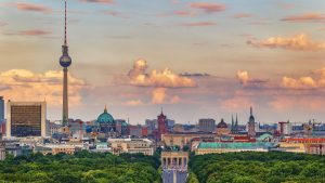 Tiergarten Park with Brandenburg Gate and the city skyline behind. Photo: Westend61/Getty