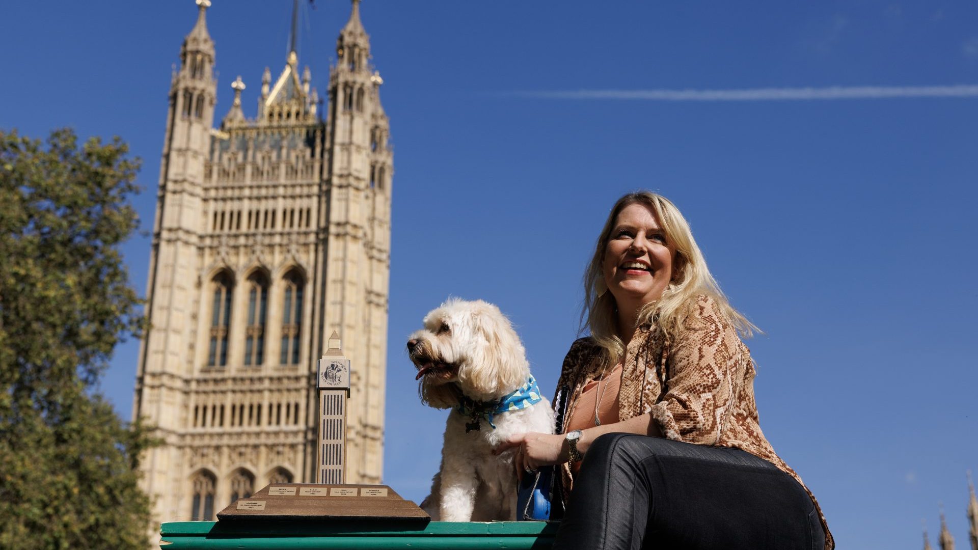 Mims Davies poses with her dog TJ the Cockapoo (Photo by Dan Kitwood/Getty Images)