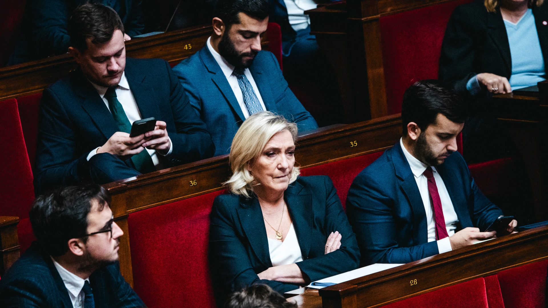 A ‘pensive, worried-looking’ Marine Le Pen in the French parliamentary chamber, November 28. Photo: Amaury Cornu/Hans Lucas/AFP/Getty