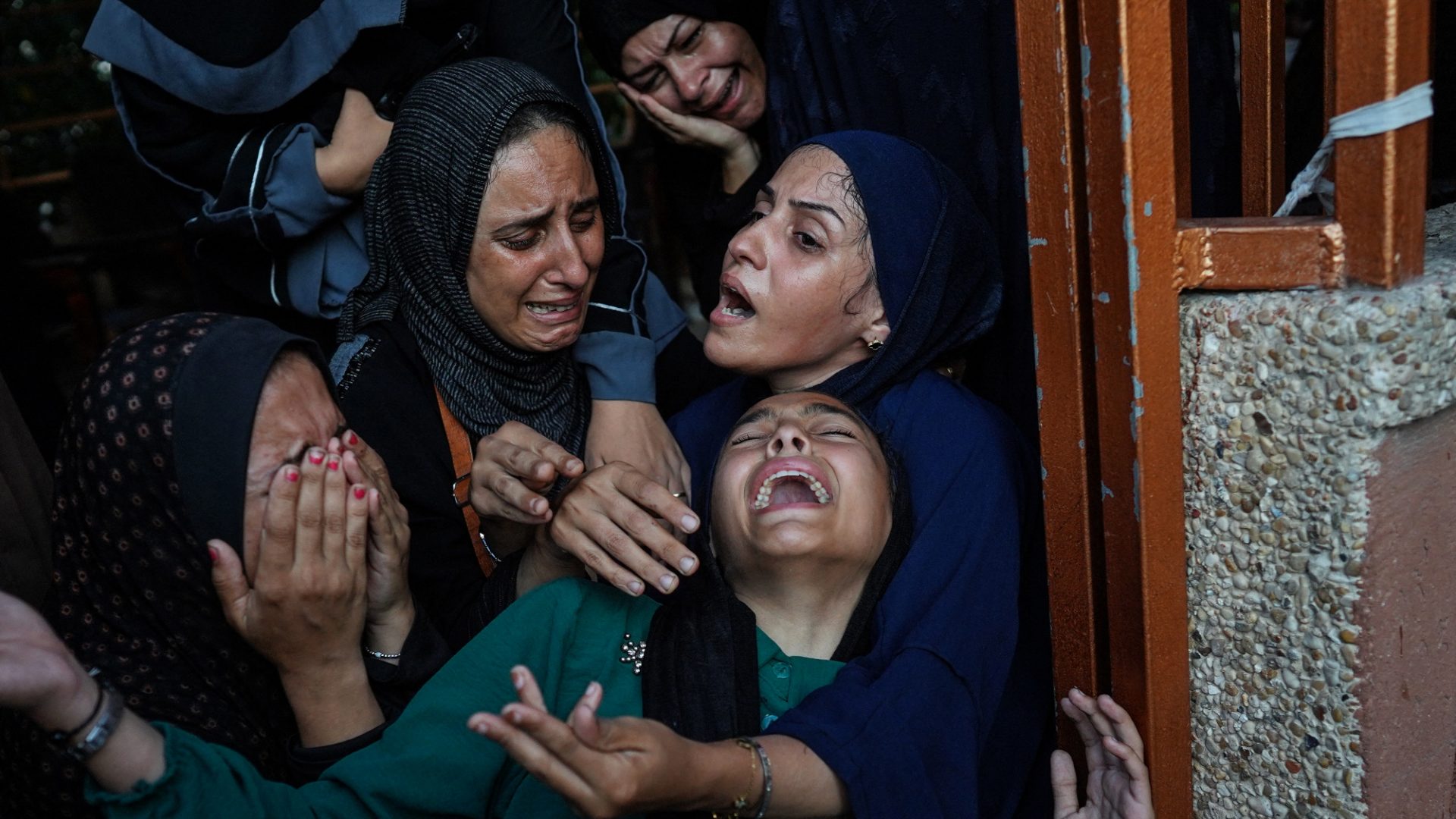 July 22: Palestinian women mourn family members killed in the Israeli bombardment of Khan Yunis in southern Gaza. Photo: Bashar Taleb/AFP/Getty  