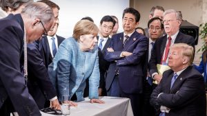 June 2018: German chancellor Angela Merkel deliberates with US president Donald Trump at the G7 summit in Charlevoix, Canada. Photo: Jesco Denzel/Bundesregierung/Getty