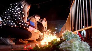 People light candles during several days of mourning in Podgorica, the capital of Montenegro, on January 2, 2025, after a gunman killed 12 people. Photo: Savo Prelevic/AFP/Getty