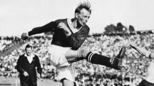 One of the world’s finest pre-war footballers, Austria’s Matthias Sindelar, shoots for goal in the 1931 international against Germany in Berlin, which Austria won 6-0. Photo: ullstein bild/Getty