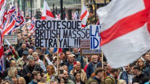 Anti-immigration protesters march through London, October 2024. Photo: Thomas Krych/Anadolu/Getty