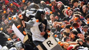 The annual Battle of the Oranges gets under way at the Carnival of Ivrea in northern Italy, as the aranceri carri da getto (orange-throwers in carts) take on the aranceri on foot. Photo: Franco Marino