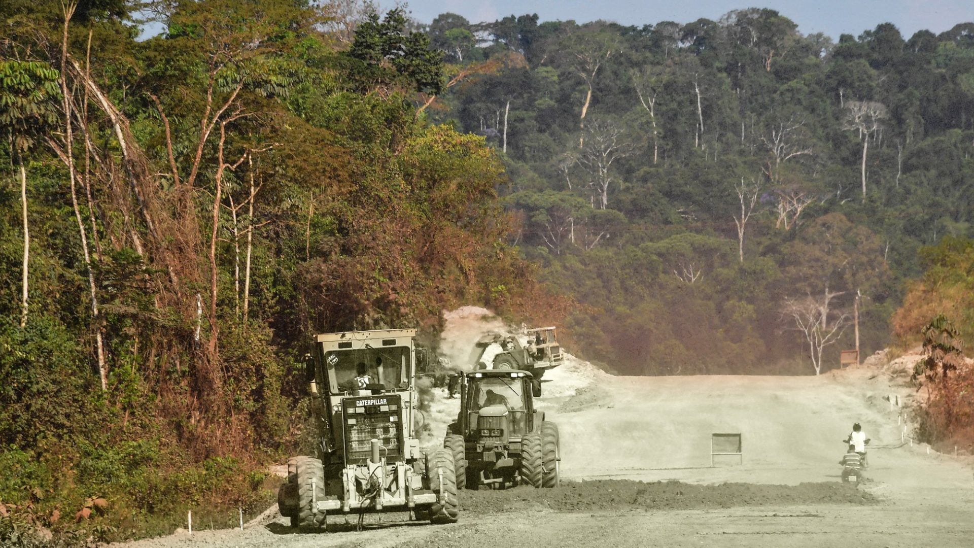 Men on tractors work on a new section of the Trans-Amazonian highway near Itaituba, Pará state, Brazil, in the Amazon rainforest. Photo: Nelson Almeida/AFP/Getty