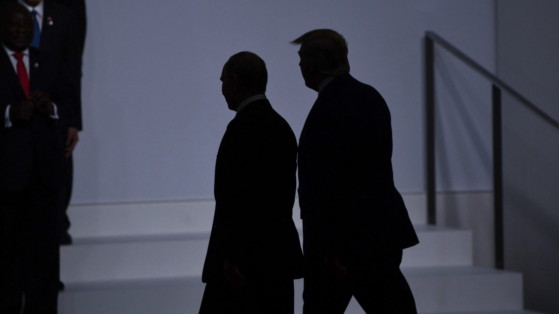 Donald Trump walks with Russia's President Vladimir Putin before taking a family photo at the G20 Summit in Osaka (2019). Photo: BRENDAN SMIALOWSKI/AFP via Getty Images