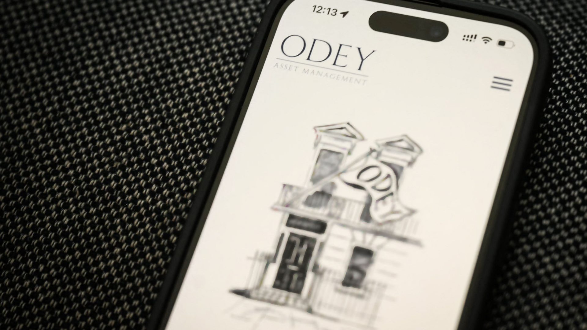 A phone displays the website of the now defunct Odey Asset Management. Photo: DANIEL LEAL/AFP via Getty Images